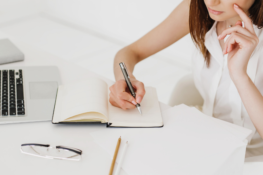 woman writing in journal