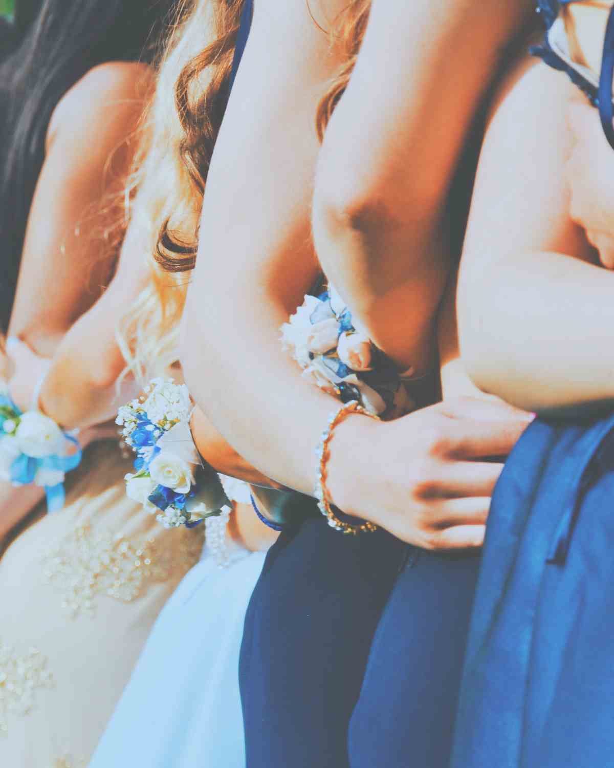 Girls in fancy dresses and wrists corsages on prom night featured image